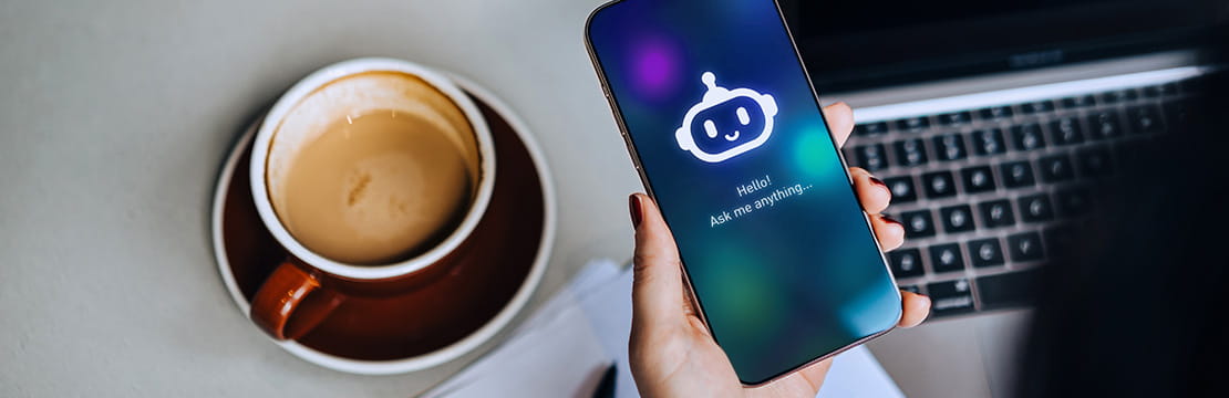 Business owner using an AI assistant on a smartphone, representing responsible AI use and governance.